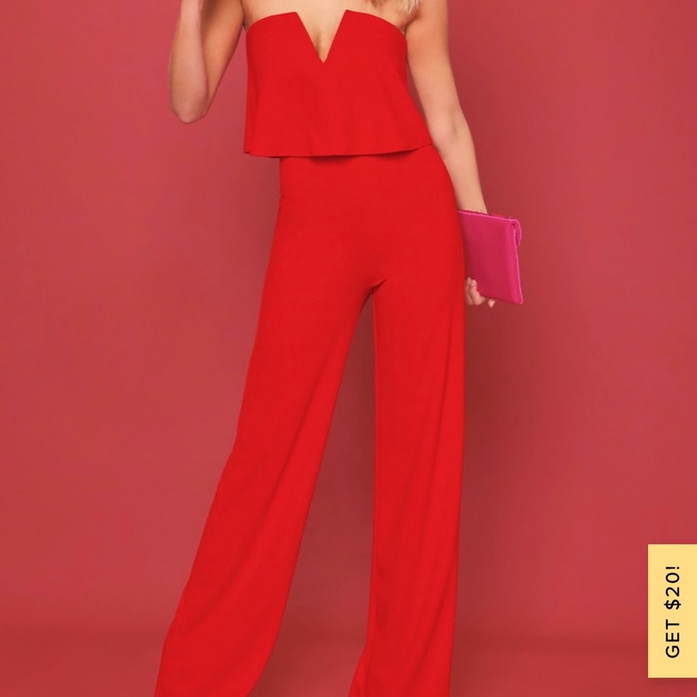 Worn once. Red jumpsuit. Gorgeous fit! True to size